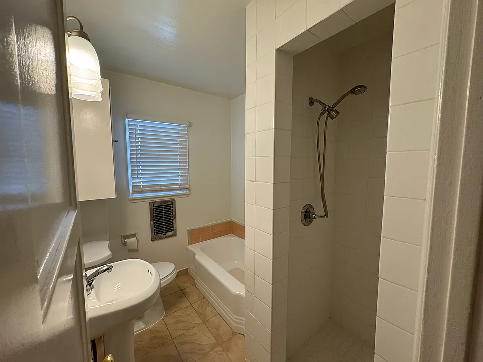 Bathroom with tub and shower