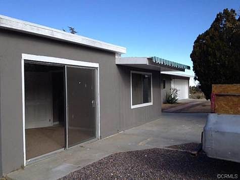 Patio door off master bedroom.  This home has a ranch style spli