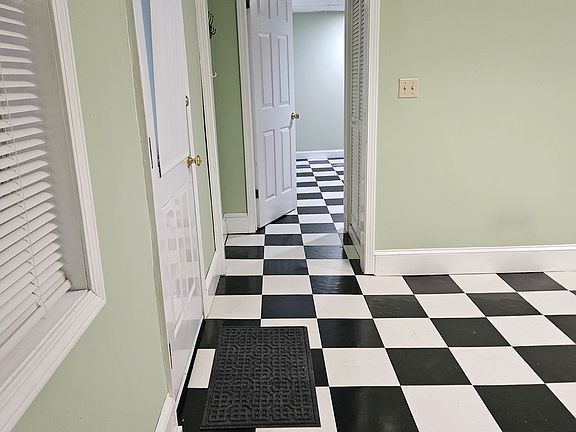 From front of living area, looking through hall to bedroom