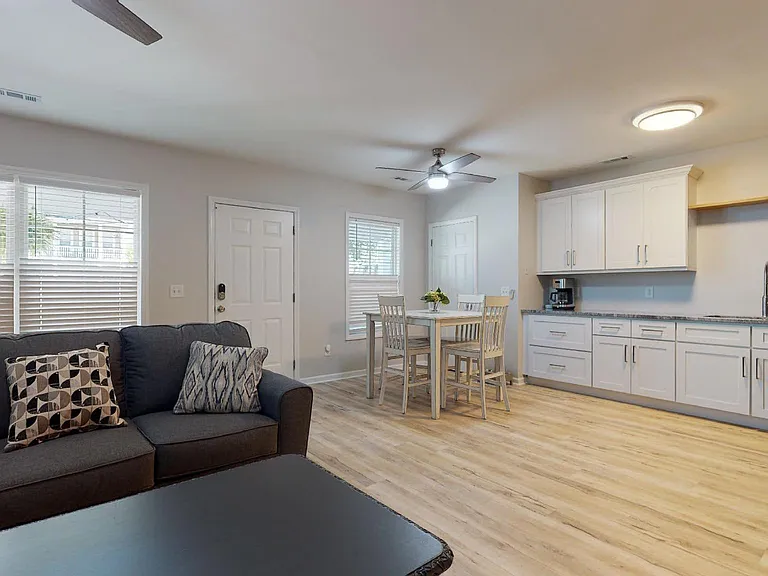 looking at the front door and pantry door is in the corner