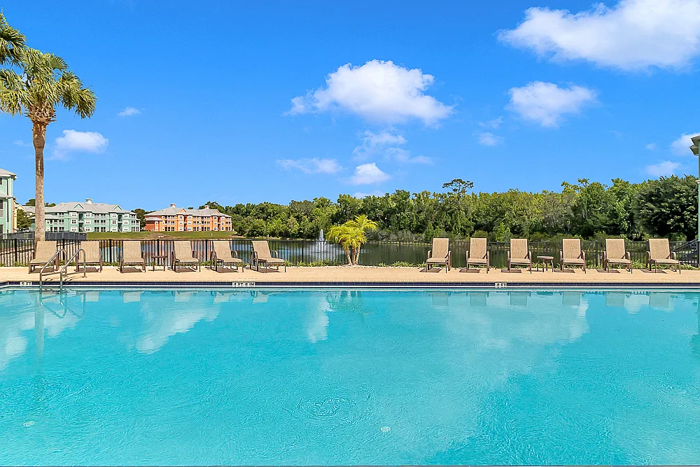 Swimming Pool Overlooking Lake - Bermuda Estates at Ormond Beach