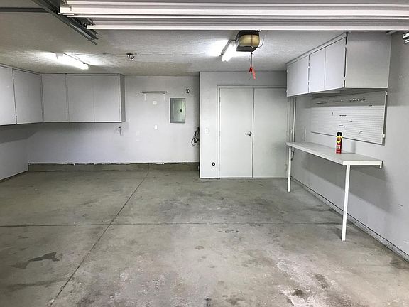 Spacious garage with plenty of storage.
