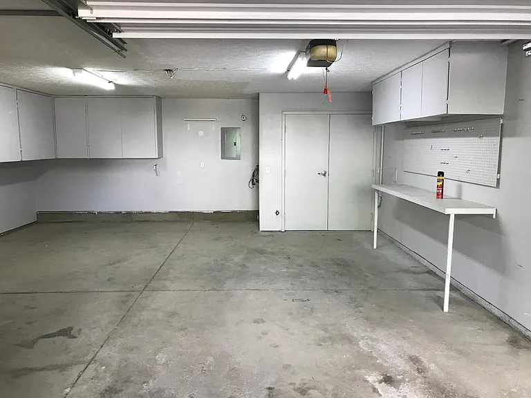 Spacious garage with plenty of storage.