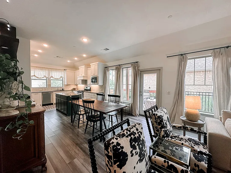 Next to the living room is the dining room and door to your personal fenced in yard