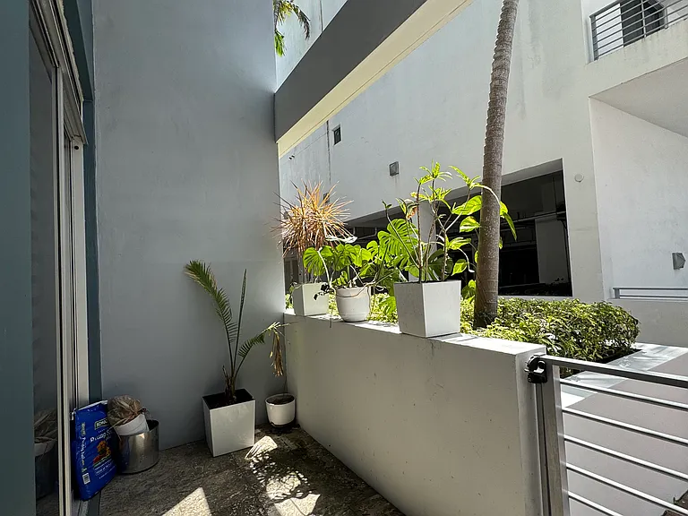 Secondary Entrance - Private secondary entrance tucked away in a quiet alley, offering added privacy and convenience. Step directly onto your own balcony with immediate access to nearby restaurants and cafes just feet away_perfect for seamless city living