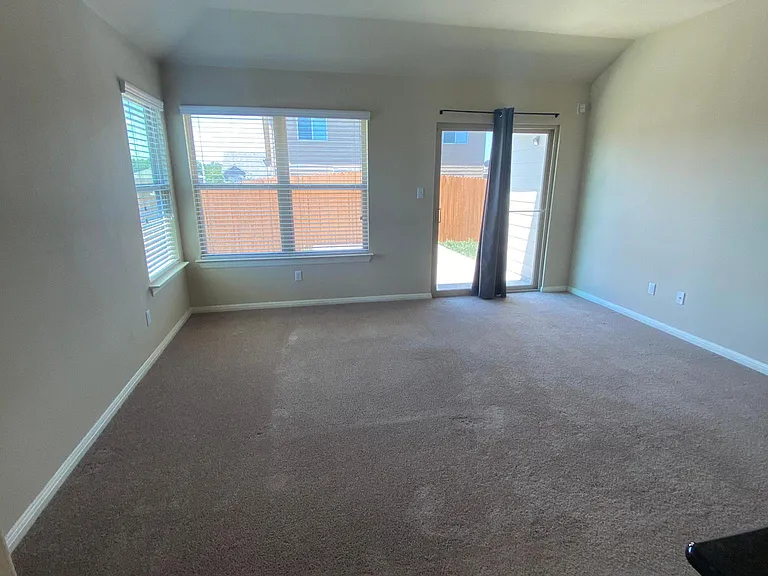 Family room with sliding door going out to the backyard