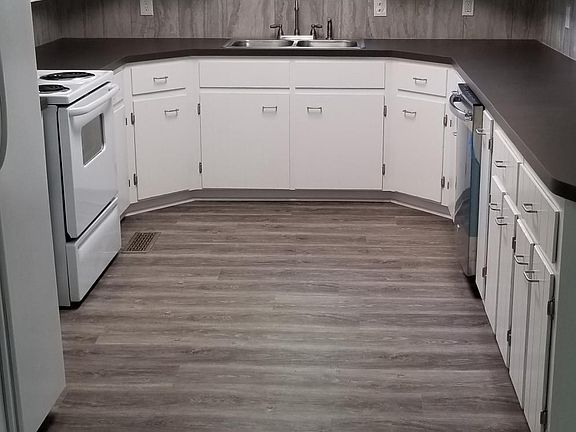 New kitchen overlooks a field. Includes a garbage disposal,