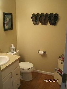 The half bath is a generous size and has been totally remodeled.  The hardwood flooring flows through the main level.  Neutral color paint and all new fixtures were recently installed.
