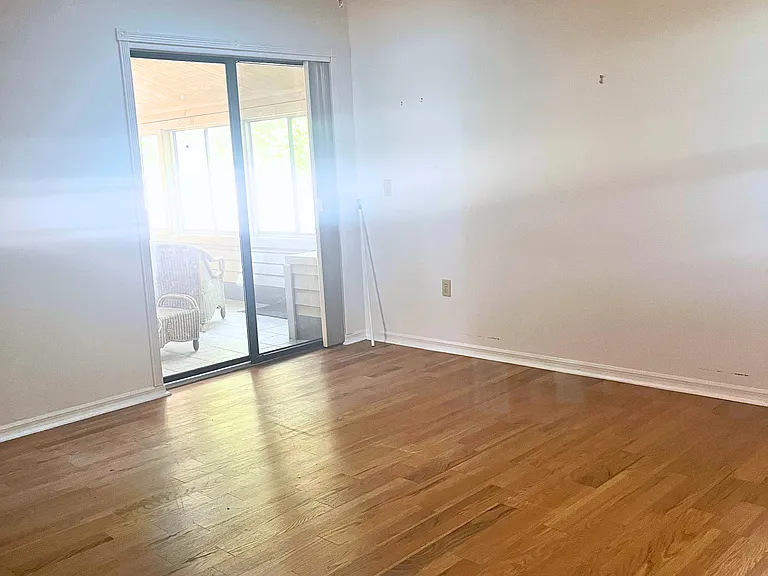 Primary bedroom leads to sunroom