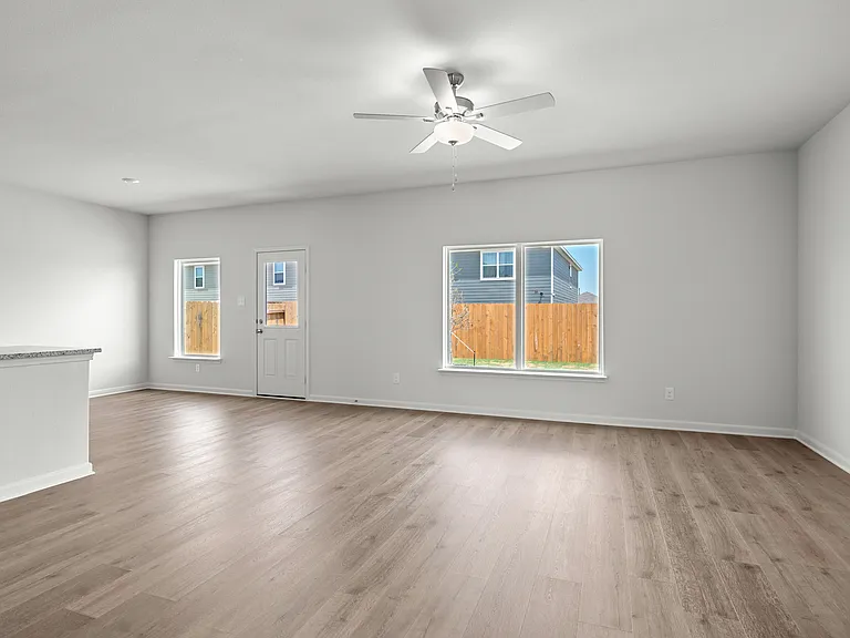 The family room has a large window that lets in great, natural light and backyard views.