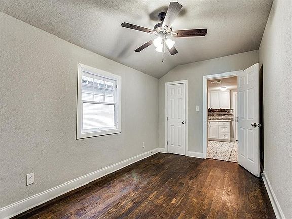 Hardwood floors throughout. Living Room. Faux wooden blinds installed.