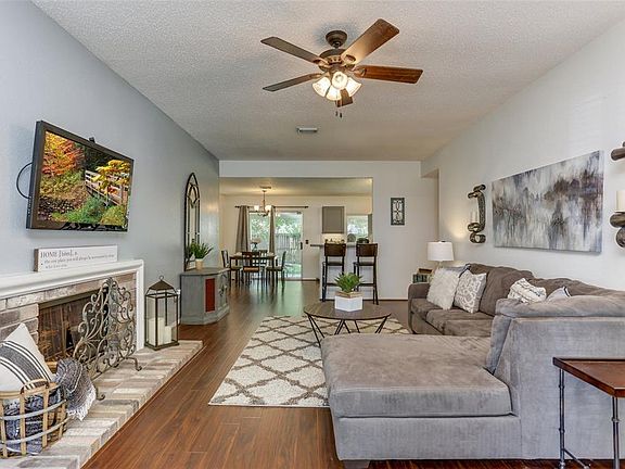 The open-concept theme continues into the dedicated dining space and kitchen area on the far side of the home.