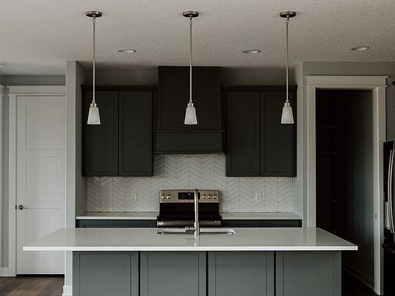 Kitchen with large center island and pendant lighting