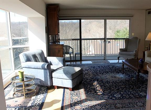 light filled living room on top corner of building