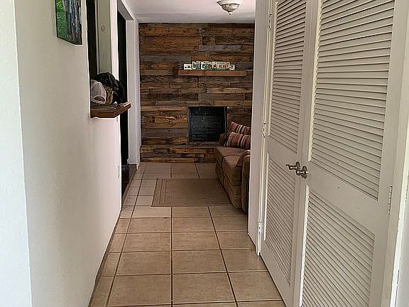 Entry hallway w/ fire place 