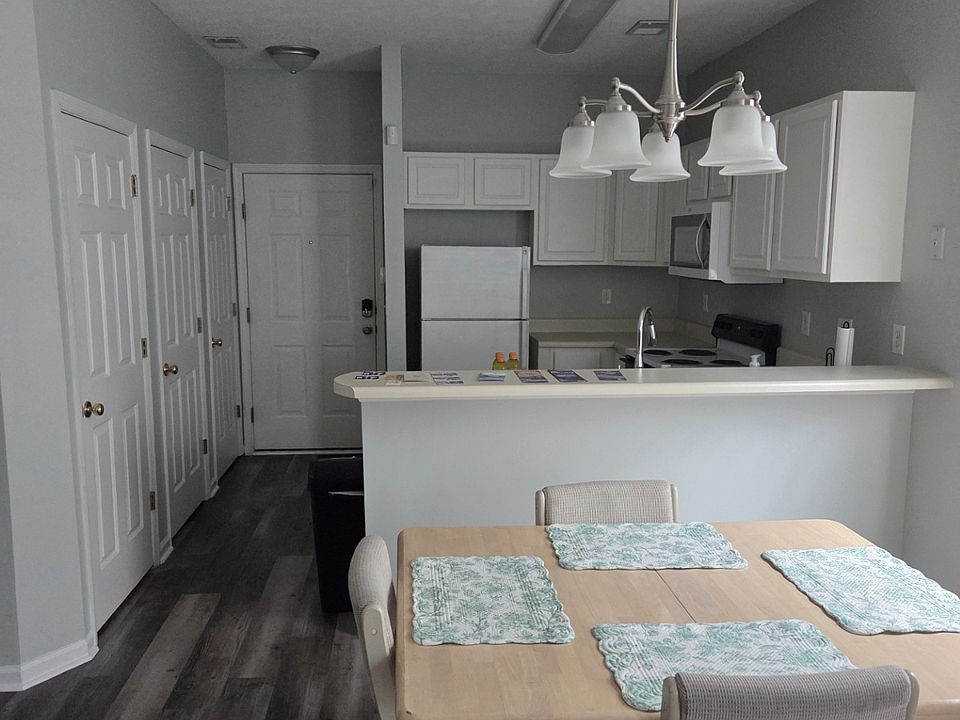 View from living room to dining area and kitchen.