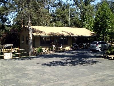 Front with all paved driveway