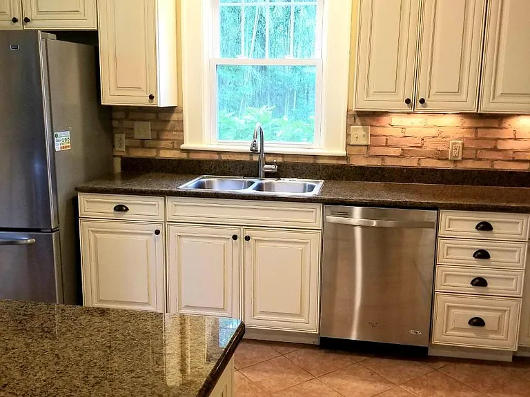 Custom cream/maple glazed cabinets with soft-close drawers