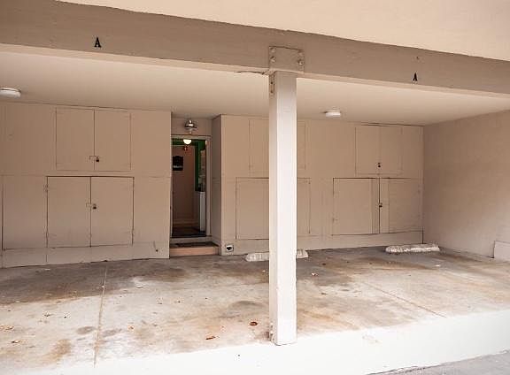 Direct entrance to 2 spaces in carport and 2 storage cabinets ( 4 total upper and lower ) street parking also available , 2 city parking permits included for overnight/guest parking