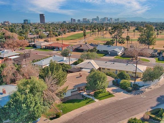 The house Is the yellow house with the white roof in the center of the picture. The Encanto Golf Course is the upper part of the photo