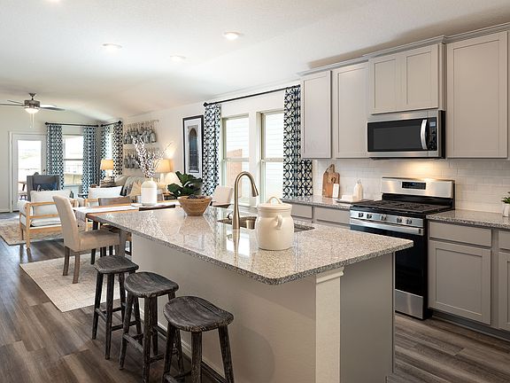 Cook delicious meals in the gourmet kitchen.
