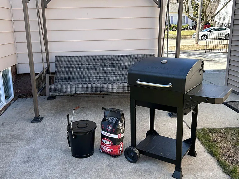 Swing to relax on and a charcoal grill to cook on!