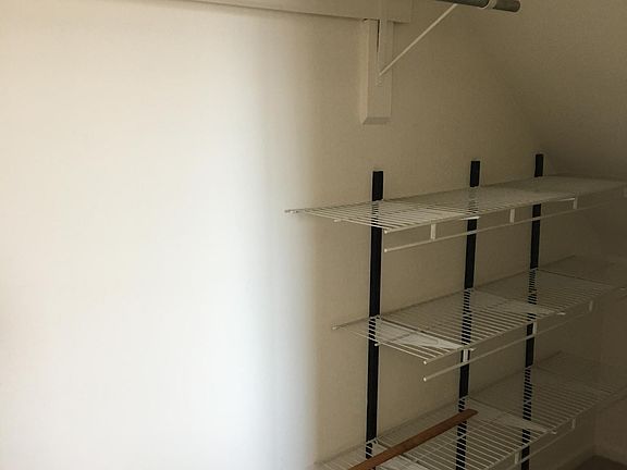 Storage closet off the bedroom with a trap door crawl space. Lots of storage space
