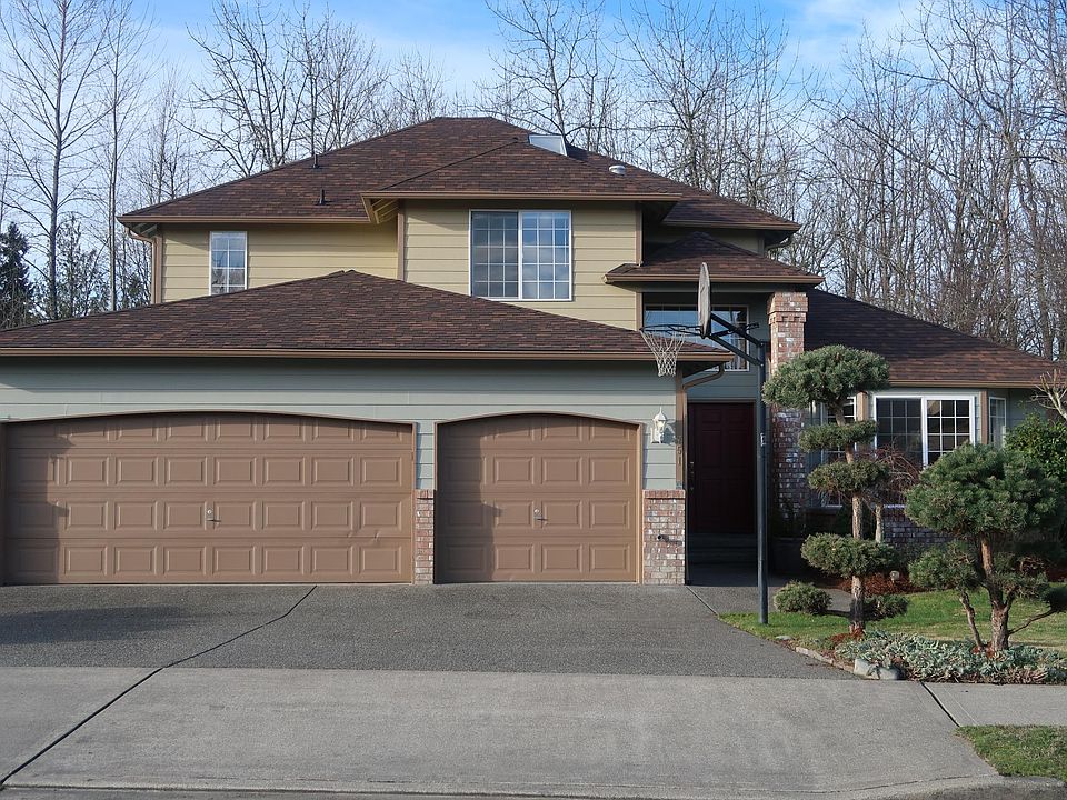Two stories home with double doors, 3 car garage