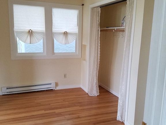 smaller bedroom with adjacent bonus room