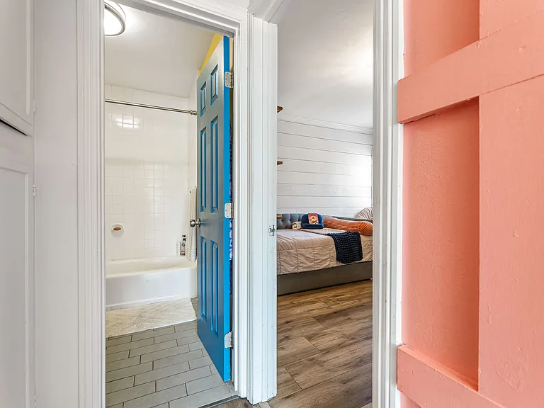 Hallway with storage closets near Bedroom 2 and Bathroom 2