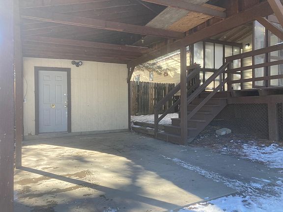 View of the entrance to the storage building. The storage area is about 10 ft by 10ft. There is a covered carport