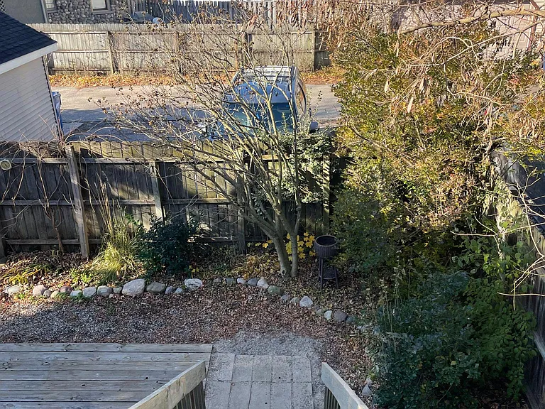 View looking back towards alley and parking spot