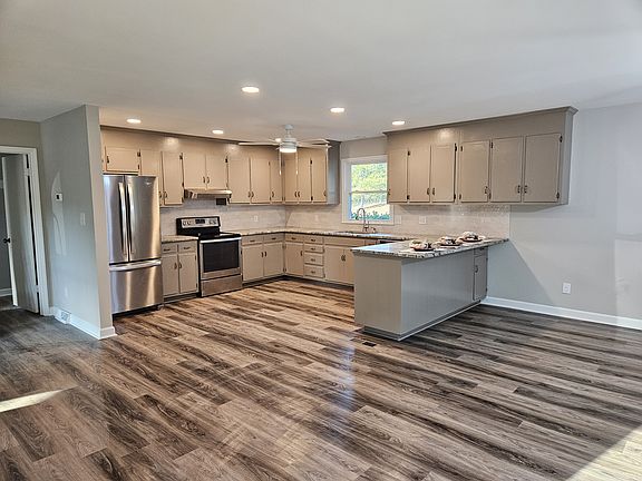 Remodeled kitchen with tons of storage and bar seating