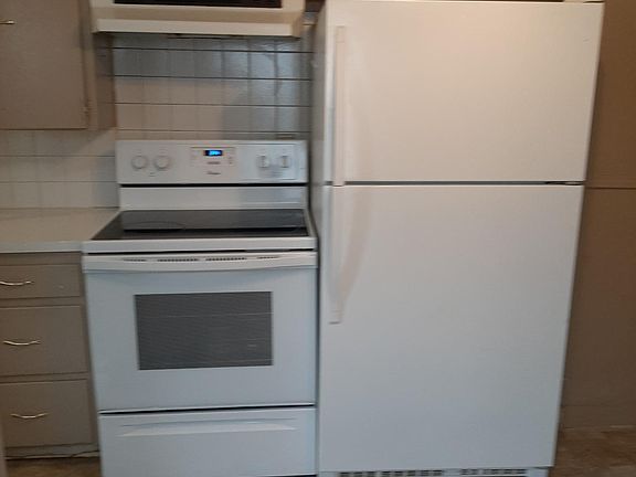 Kitchen appliances viewed from dining area