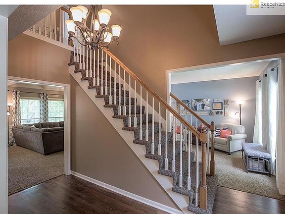Stunning entry w/ hardwoods & designer carpet on stairs to welcome guests!  Open concept to office/formal living room and formal dining room