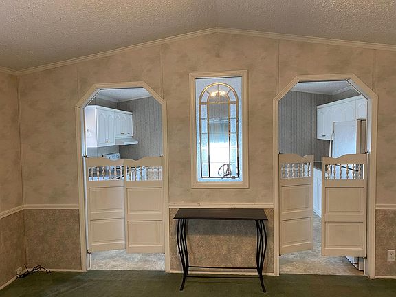 View of kitchen from the living area. Unique with saloon style doors.