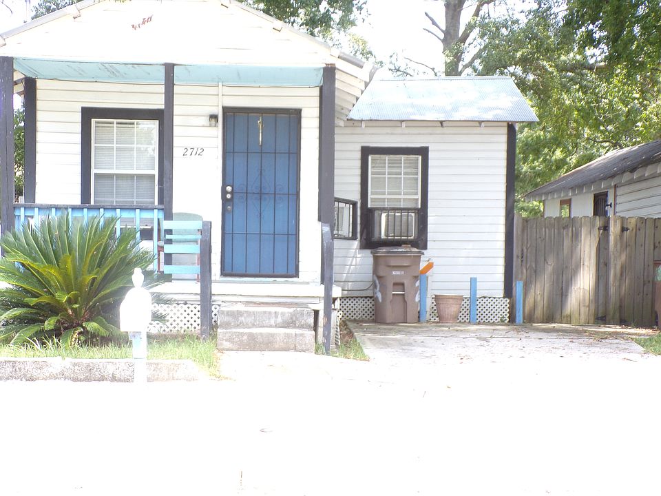 The Porch On This House Has Been Totally Renovated & The Porch Is In The Process Of Being Painted a Brown Color