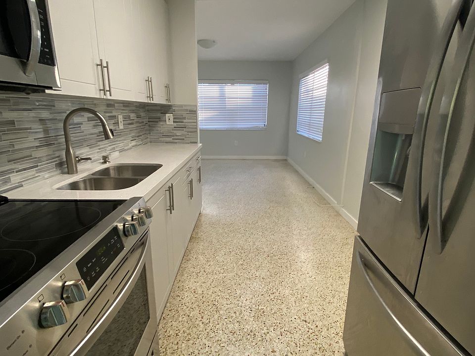 Kitchen looking into living room