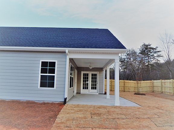 Fenced Backyard. French door swing in from Master and Living room.