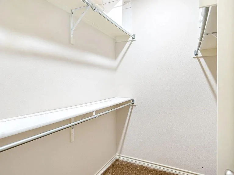 Her walk-in closet in Master