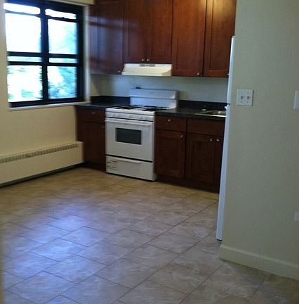 Eat In Kitchen with stone tile flooring