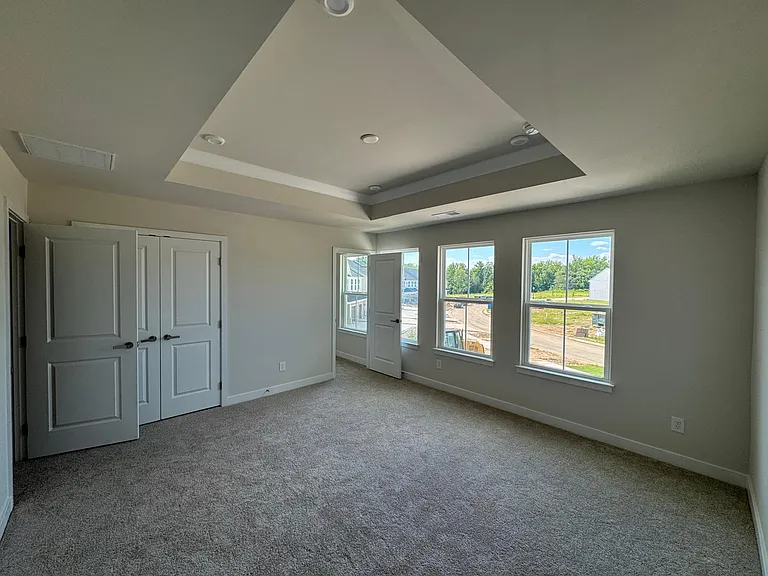 Master Bedroom with huge windows (4) and tray ceiling
