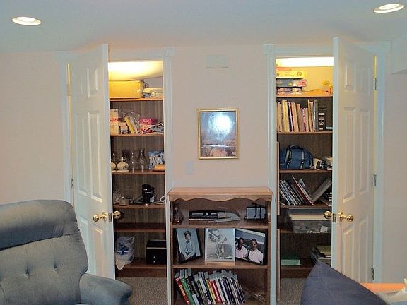 Finished storage beneath basement stairs.