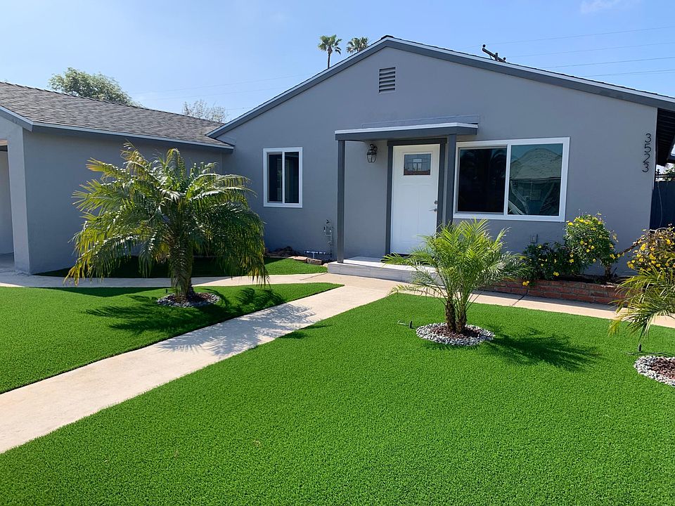 Front of Home with new landscaping, new paint, new roof, gutters and all new windows