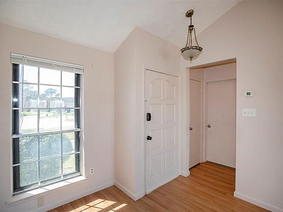 Another view of the entryway shows a lovely pendant light.