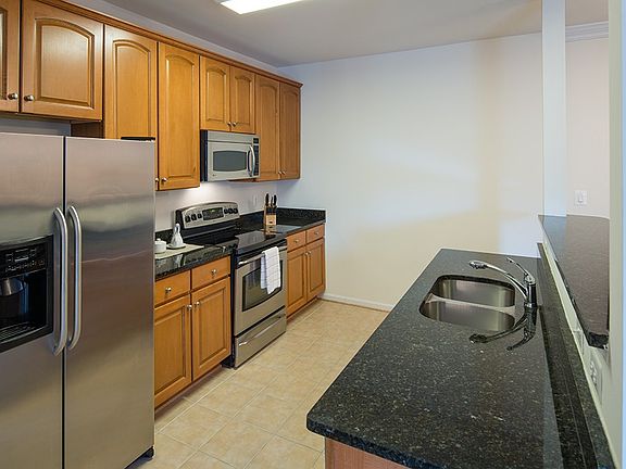 Granite countertops, recessed lighting and stainless steel appliances