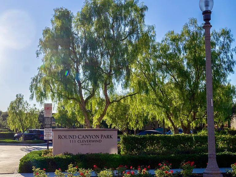 Community Amenities: View of Round Canyon Park featuring a stunning circular pool and spa, a shaded playground, picnic grills, and a great lawn space ideal for taking out pets.