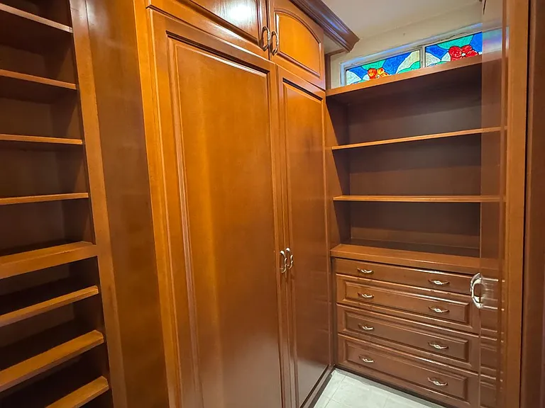 primary bedroom walk-in closet