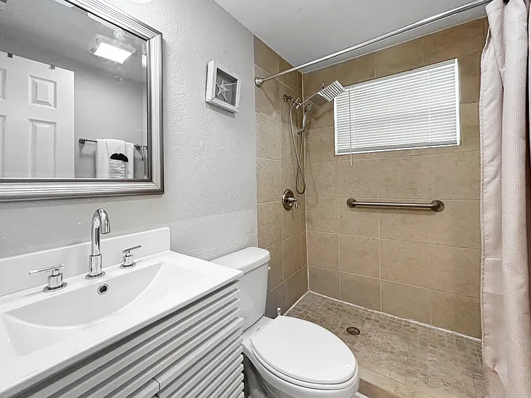 Bathroom
Clean, updated bathroom featuring a spacious walk-in glass shower and a bright vanity. Simple, comfortable, and well maintained.