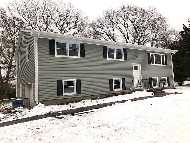 Exterior front. Under the house garage.